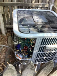 Littleton ac repair technician replacing a fan motor to restore operation.