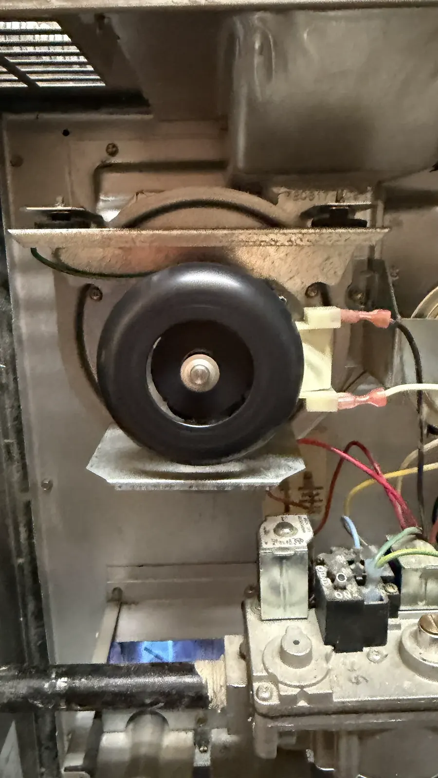 Draft inducer motor and wiring inside a Denver furnace.